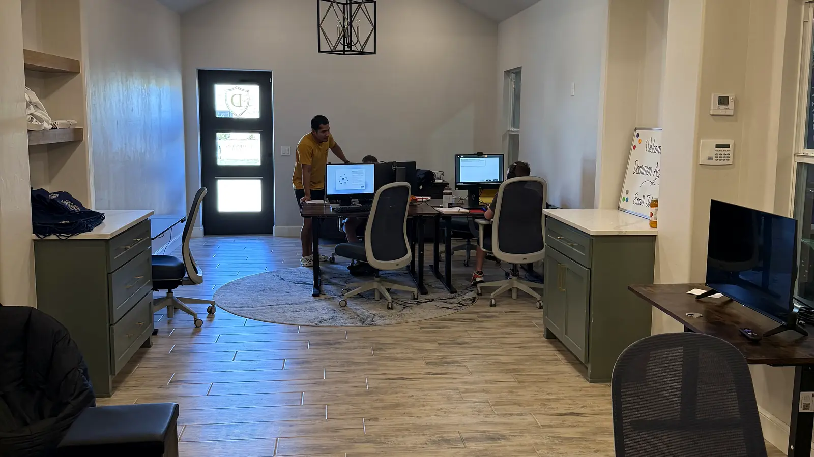 The Dominion Academy study room with students working at computer desks under a coach's supervision