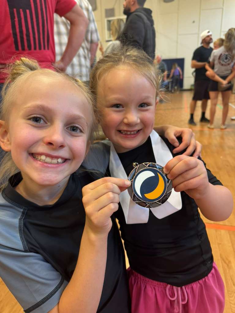 two jiu jitsu girls at a tournament two jiu jitsu girls at a tournament