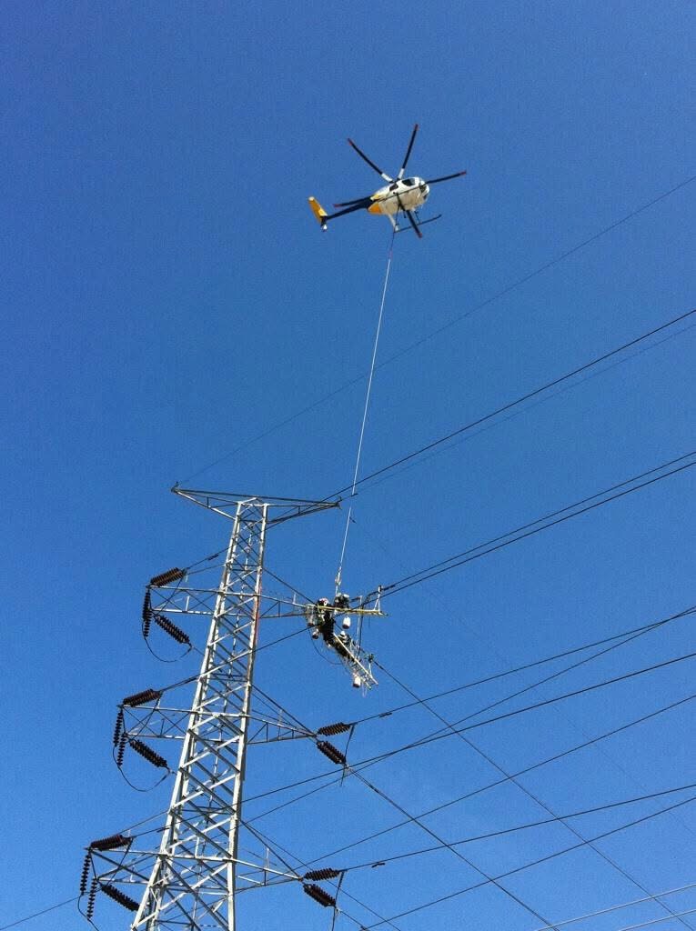 Helicopter utility operations supporting powerline and energy infrastructure work