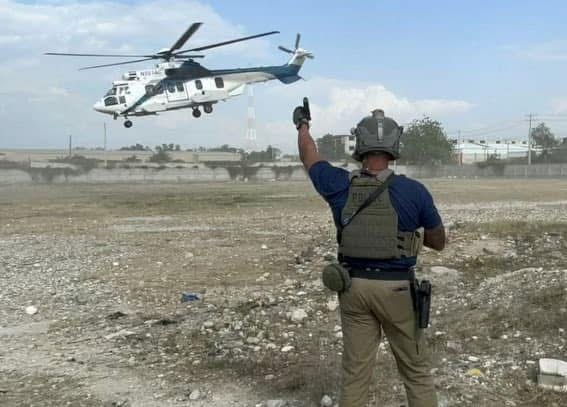 ARC founder David Tappe piloting helicopter during international aviation operations demonstrating 39 years of real-world helicopter experience across global environments