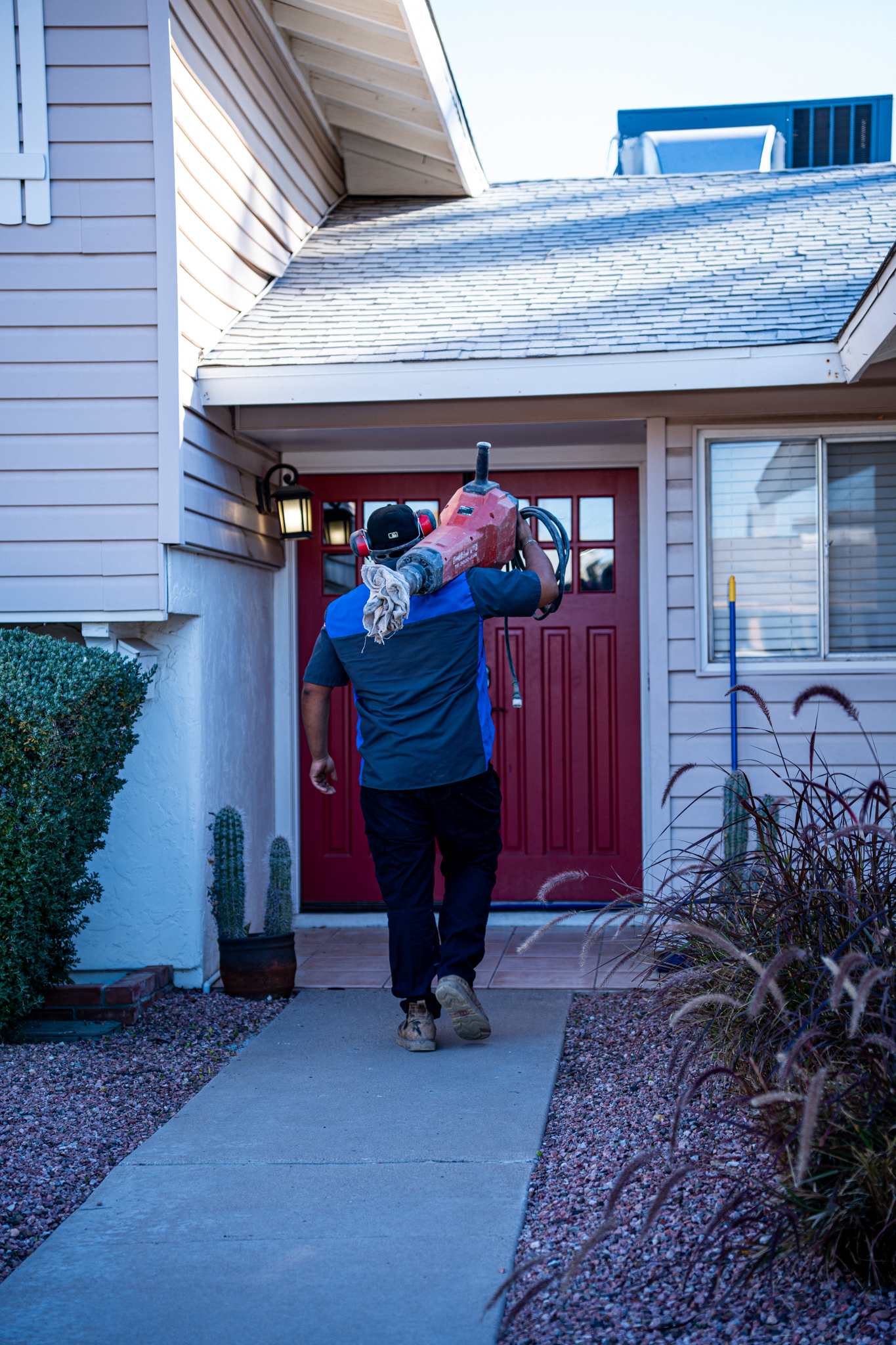Drain Warriors technician arriving for emergency plumbing service