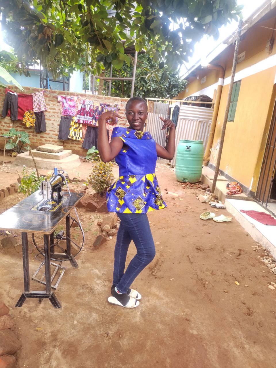 Graduate wearing garment she sewed