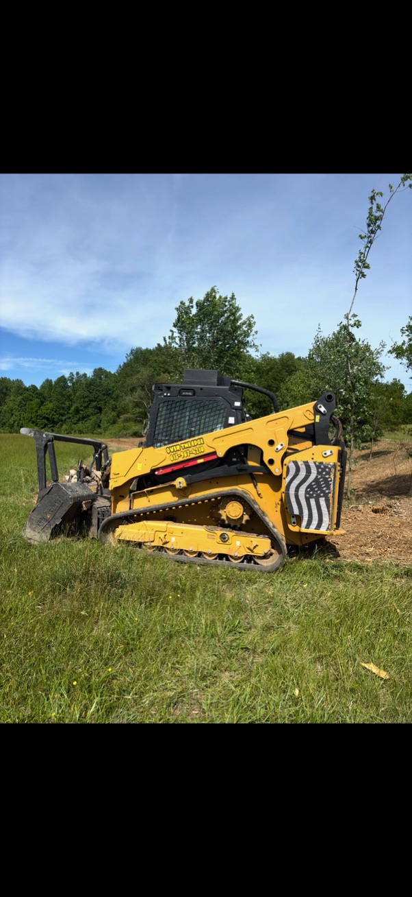 Over the Edge Forestry Mulching equipment clearing heavy brush in Smithville TN