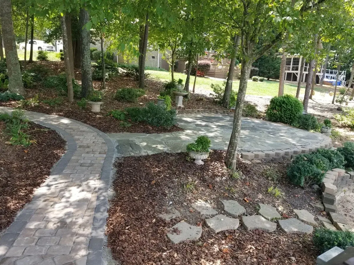 Finished LAP flagstone patio and paver walkway with mature plantings