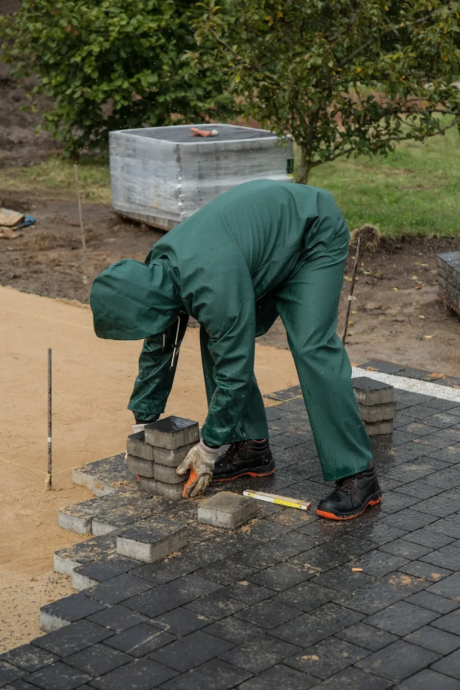 Hands-on stonework detail — illustrative of crew install craftsmanship