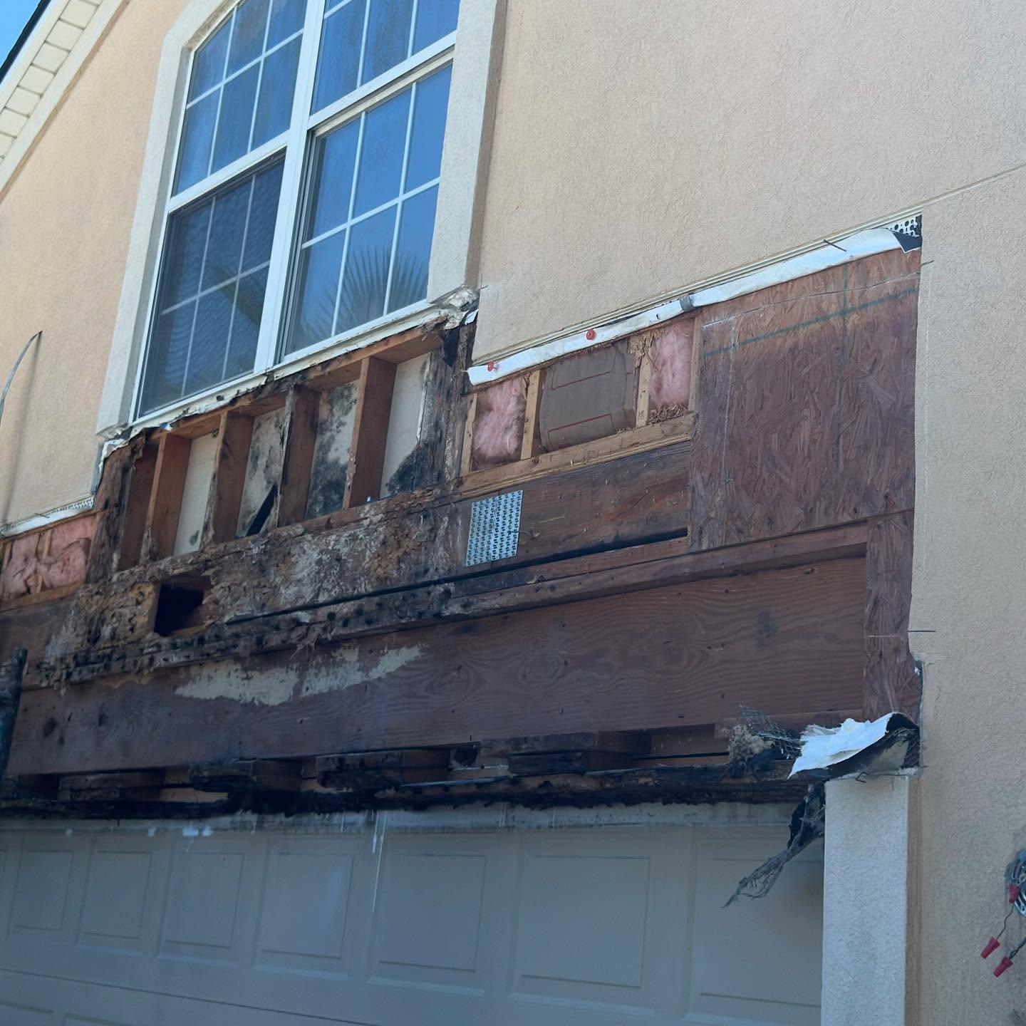 Stucco home before exterior repaint Jacksonville FL