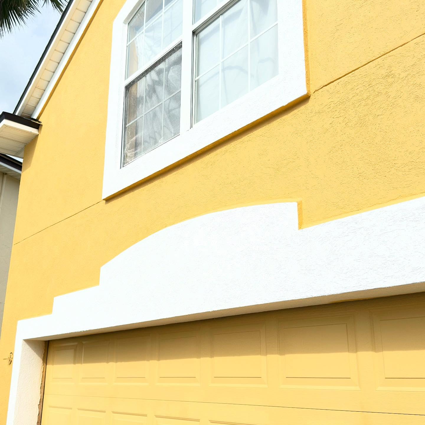 Stucco home after exterior repaint Jacksonville FL
