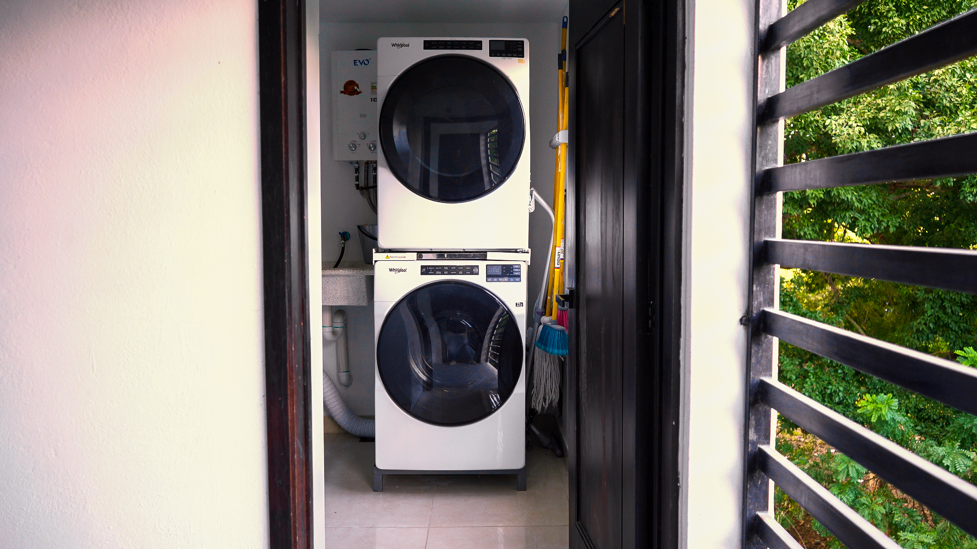 In-unit stacked washer and dryer