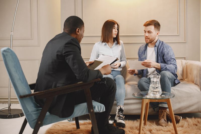 A couple talking with a therapist.