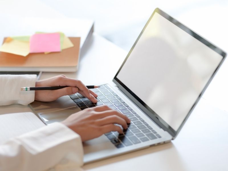  laptop resting on a desk, symbolizing learning for business courses