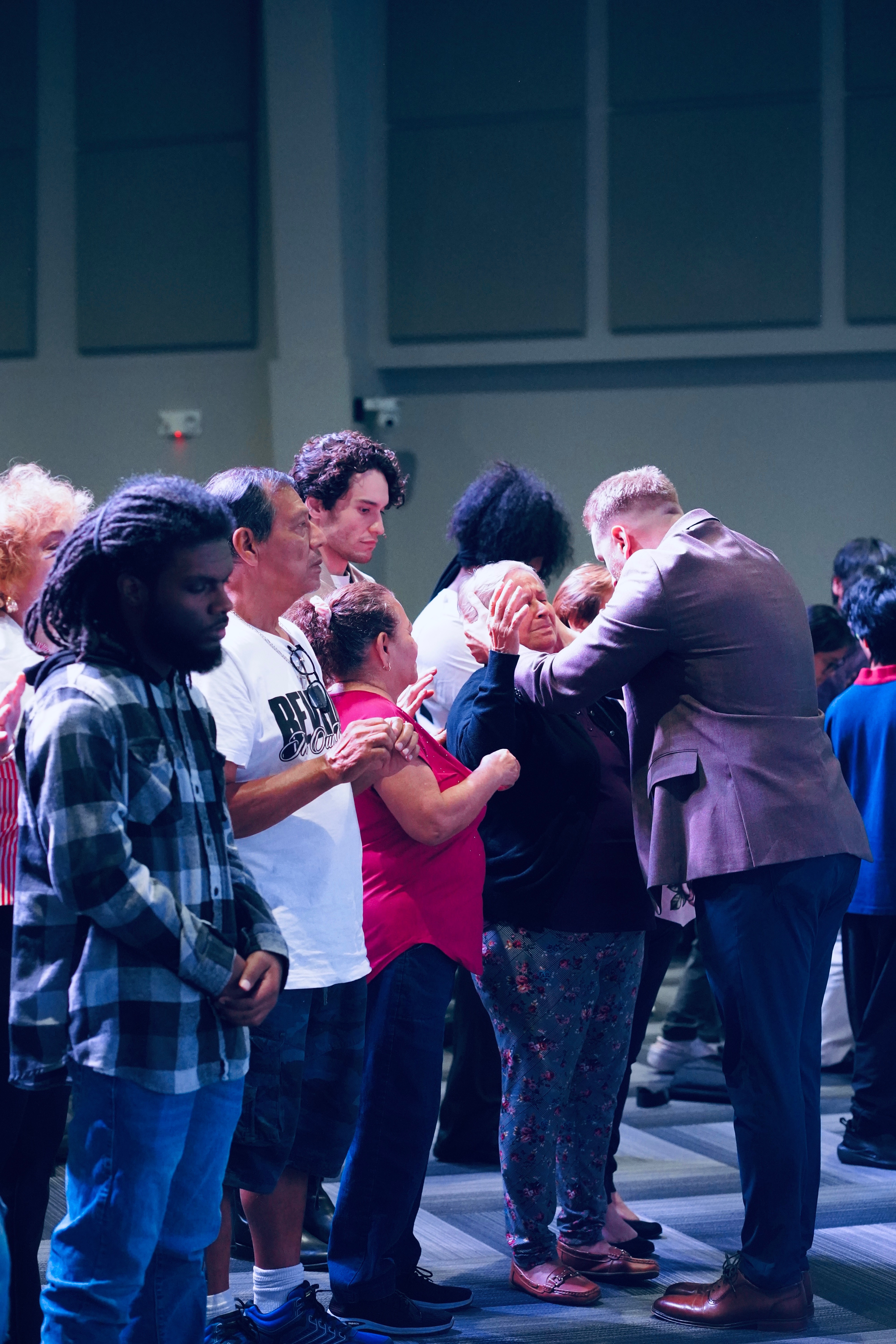 Colton praying for people at the altar