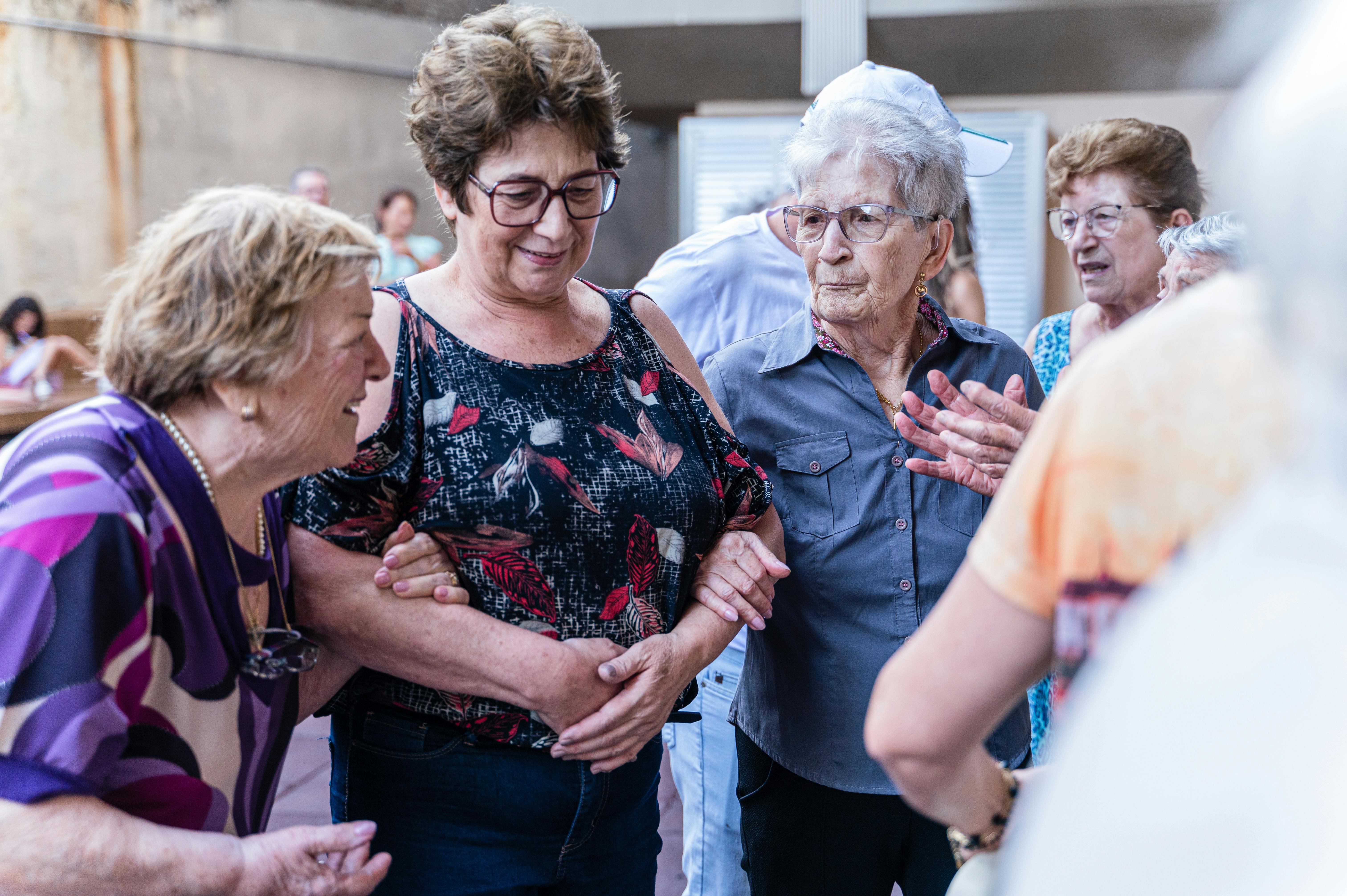 Seniors laughing and socializing together at a community adult day program