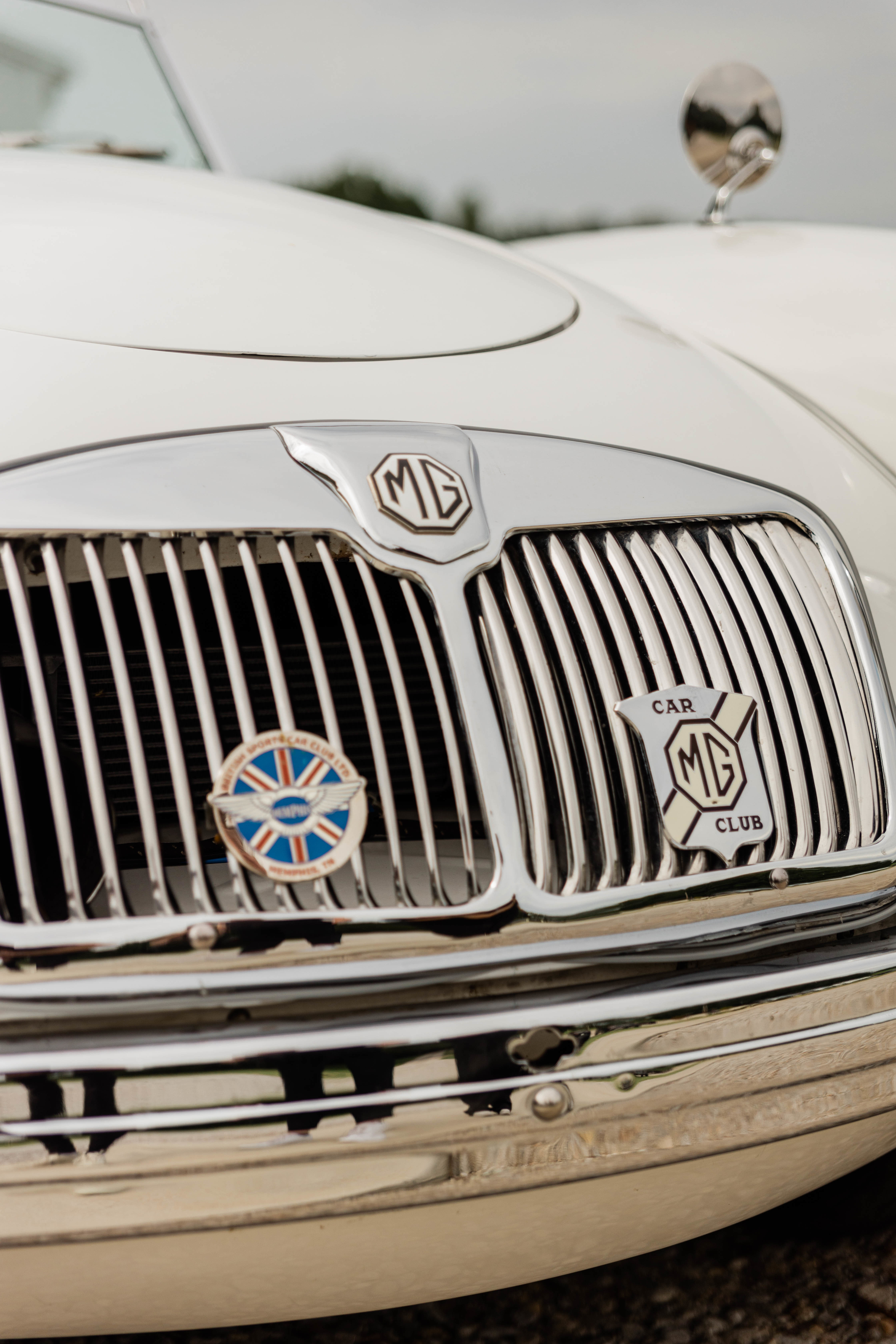 Close detail of the MG grille and car club badges