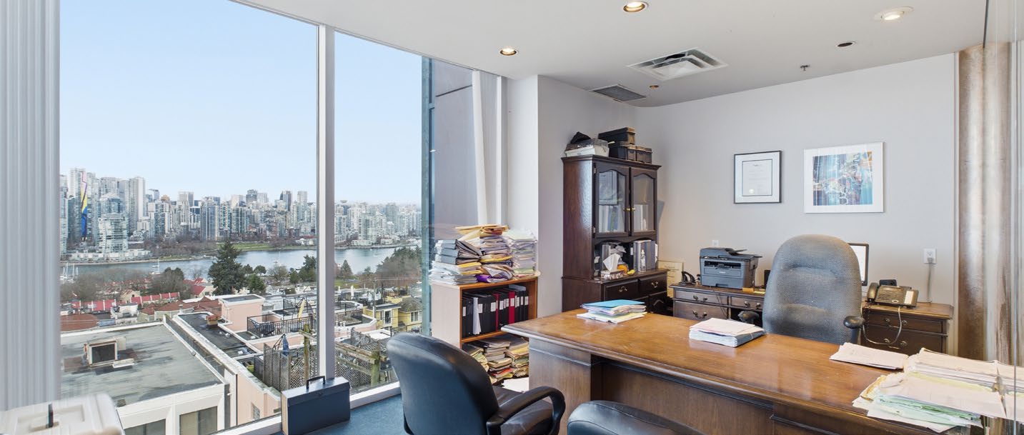 Corner office with panoramic city and water views