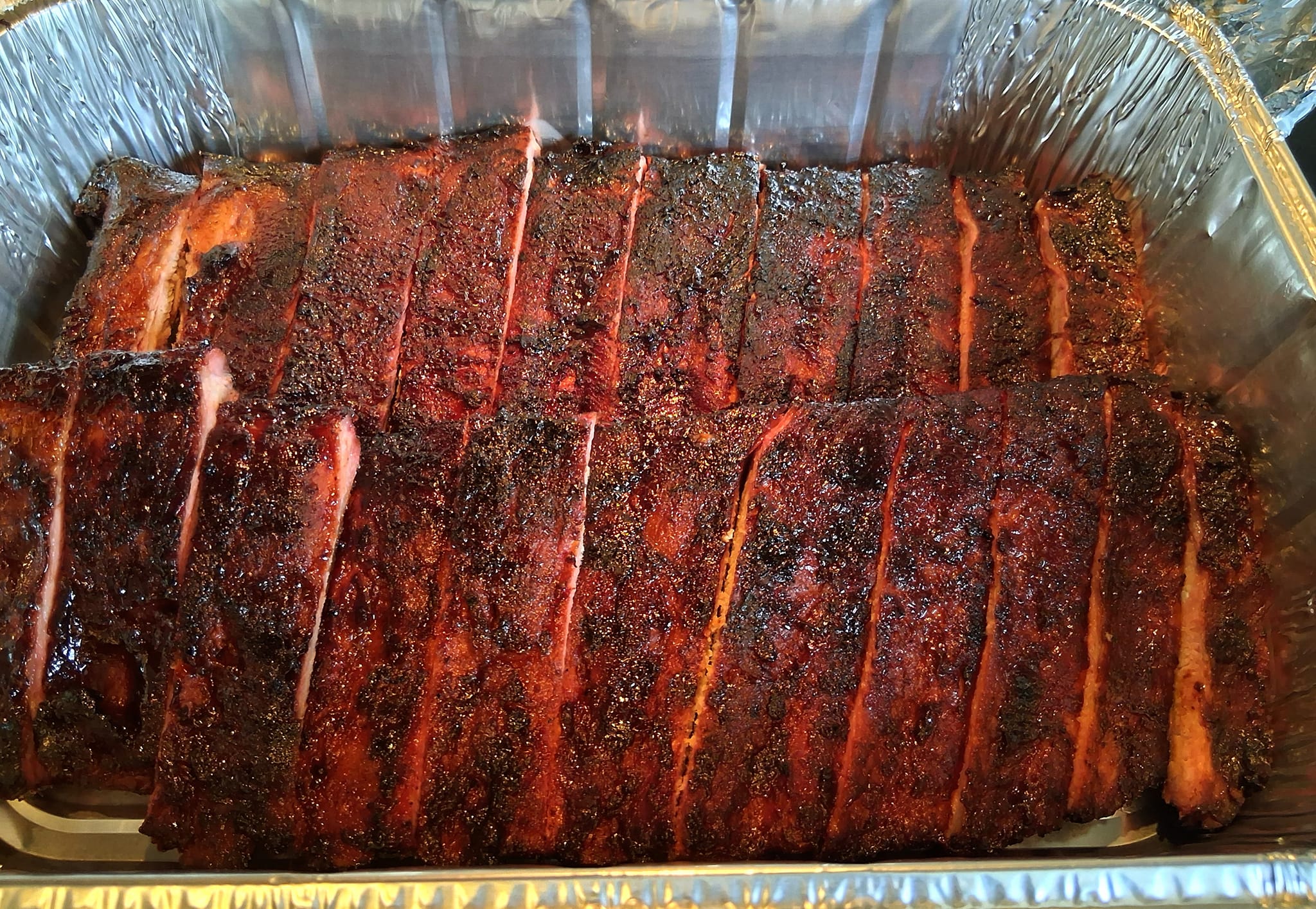 Pitmaster grilling BBQ catering at an event in Lawrence KS
