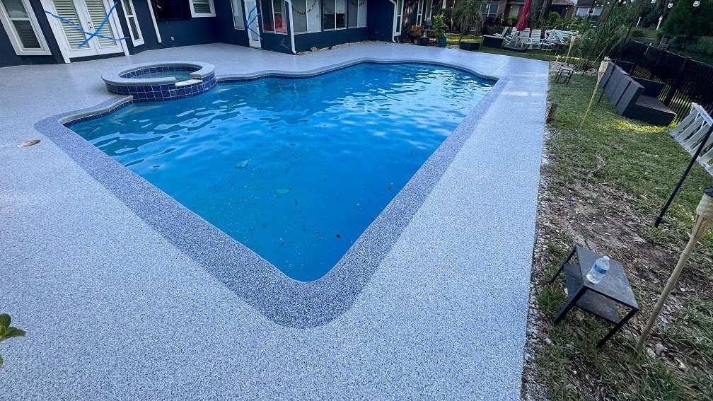 A white car in a garage with a finished floor