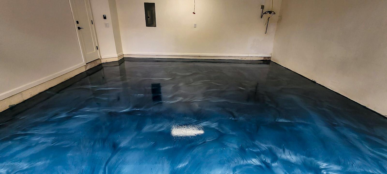A white car in a garage with a finished floor