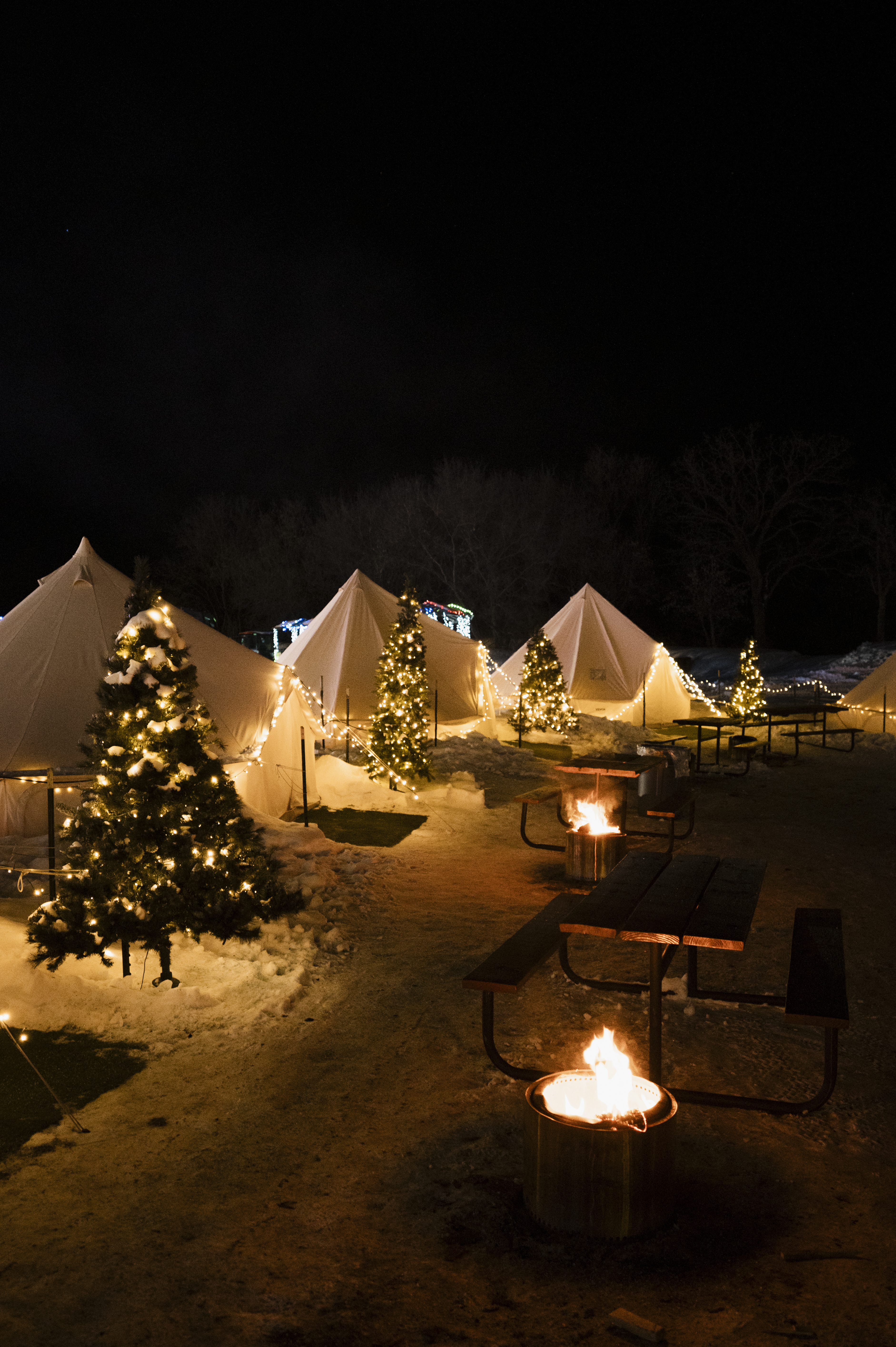 VIP tent glowing among holiday lights at Miracle at Big Rock