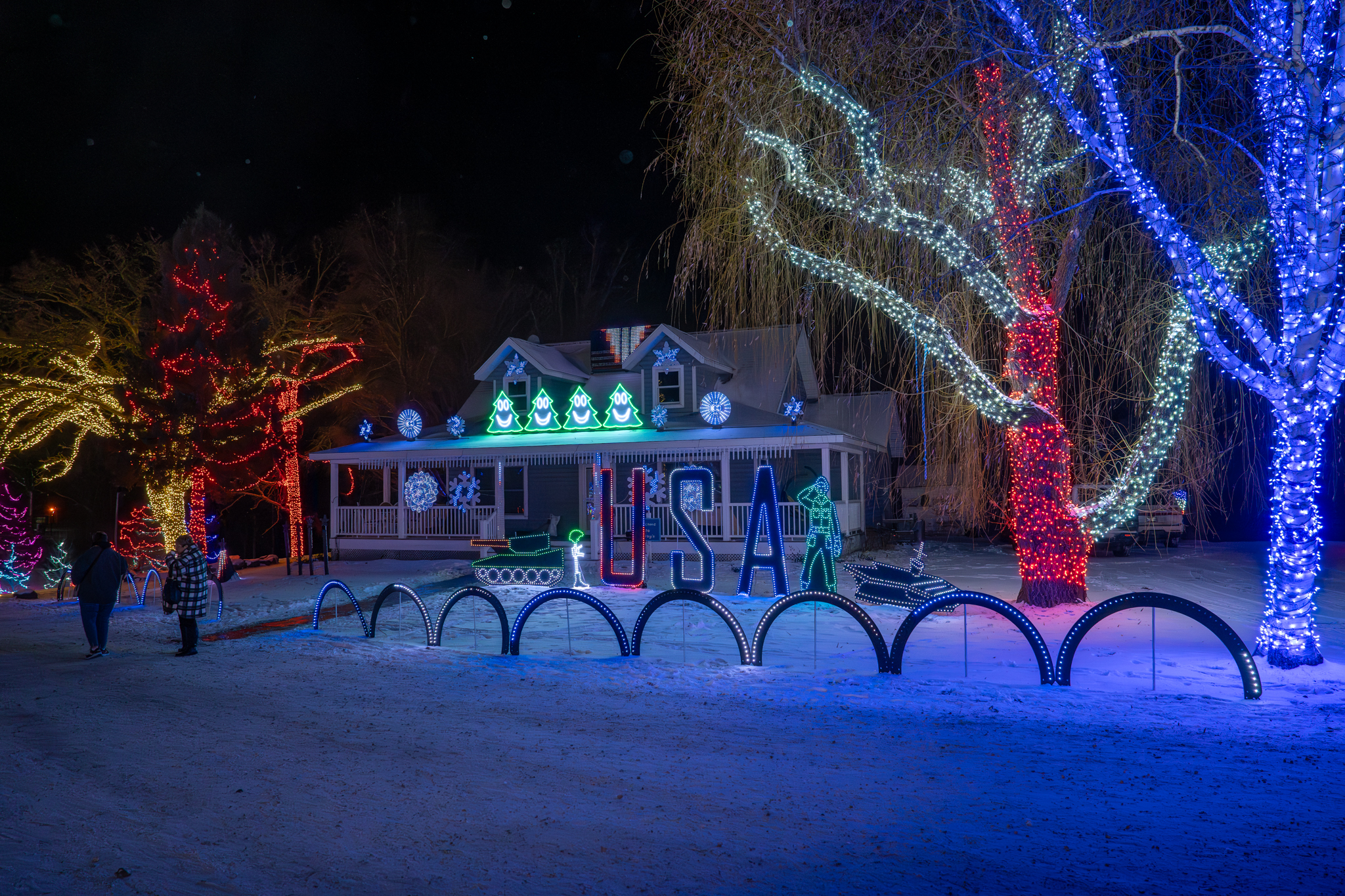 St. Croix Falls light display with glowing trees