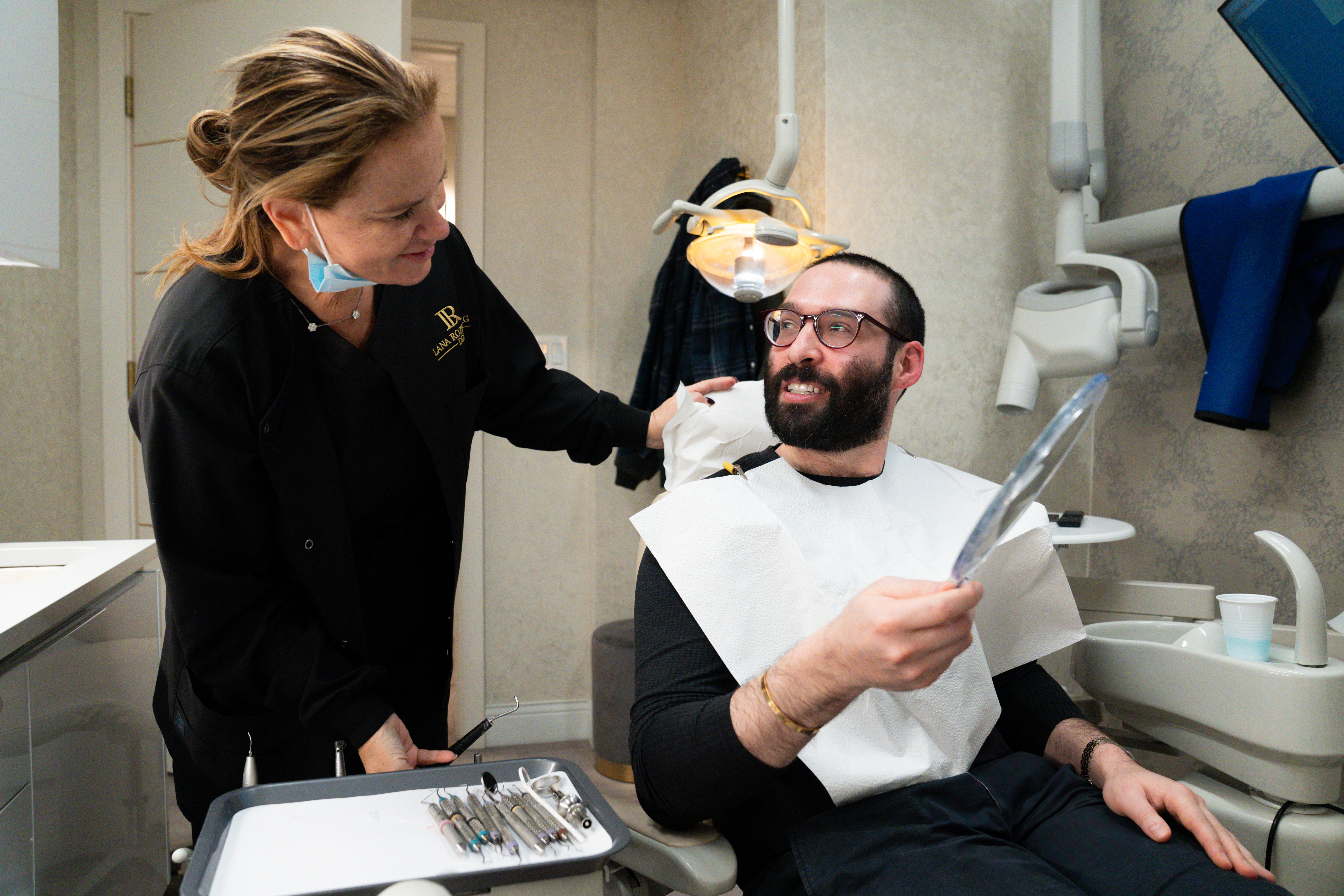 Dr. Lana Rozenberg, DDS with a patient in her Midtown, NYC office