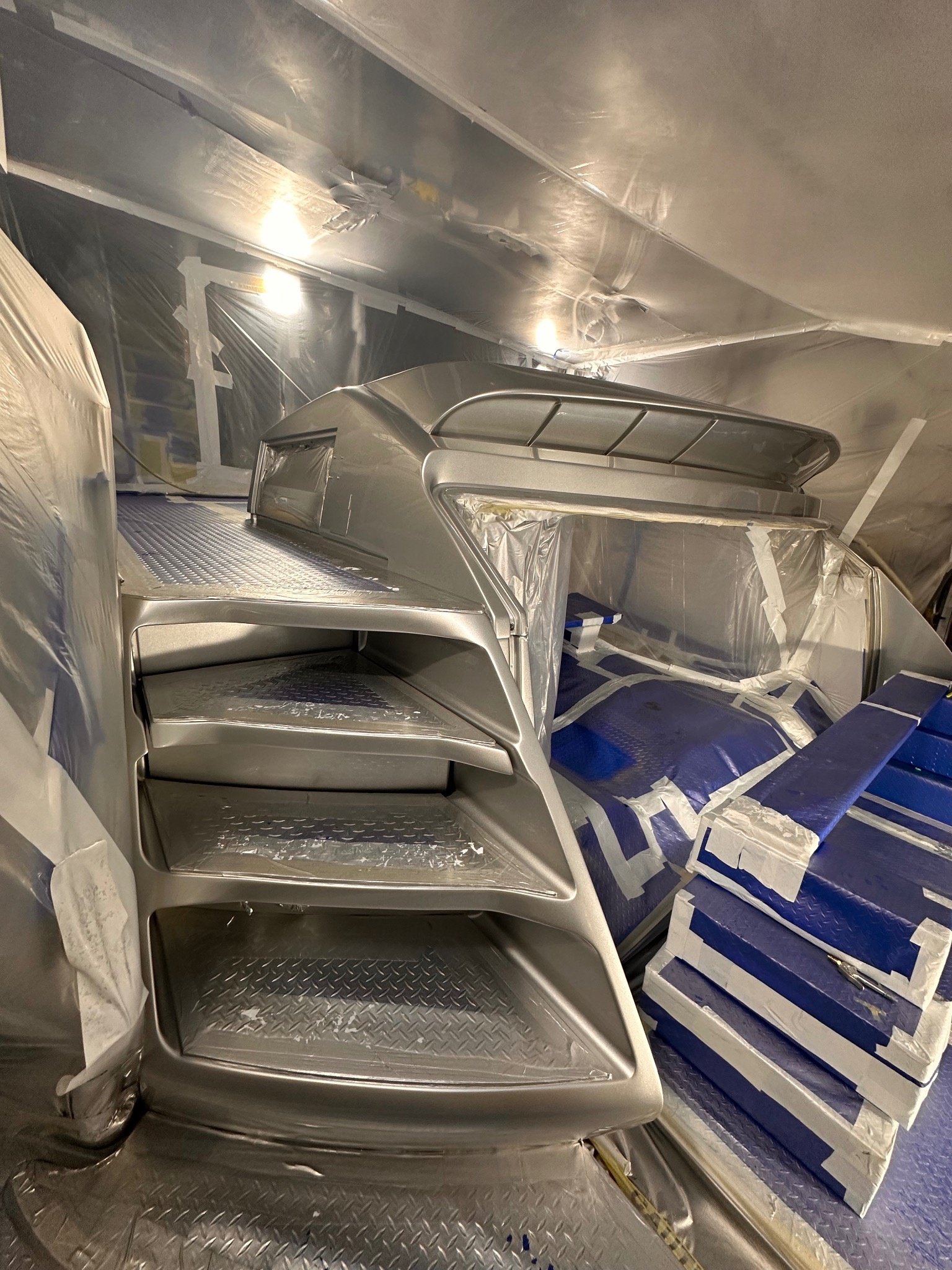 Topside refinishing in a controlled environment