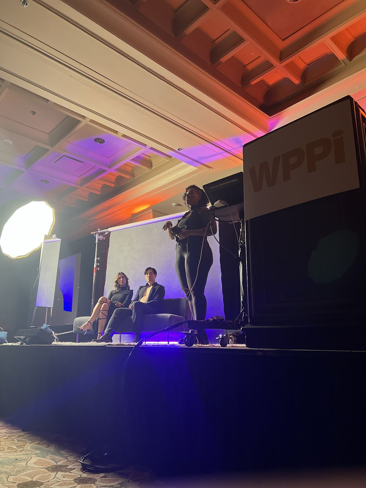 LeZandra McGinnis McKeon teaching couples boudoir on stage at WPPI