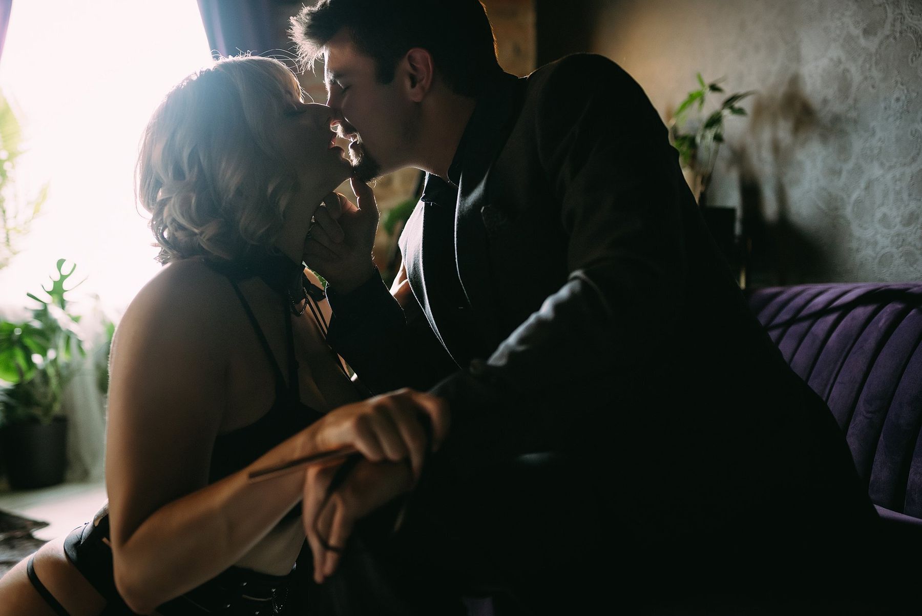 Intimate couples boudoir portrait of a kiss in soft window light at LeZandra Photography, Norfolk, VA couples boudoir photographer