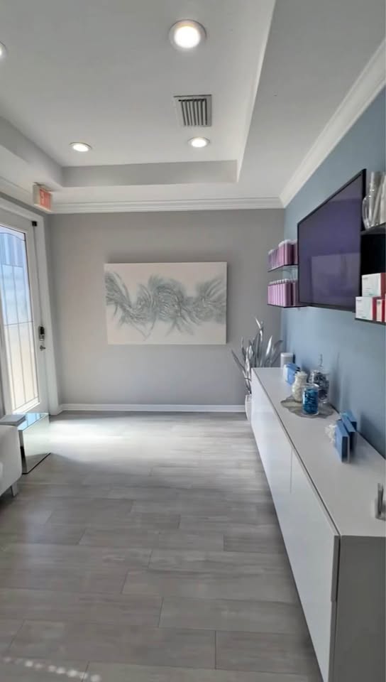 Shared Lavish lounge with sofas and decorative wall panels