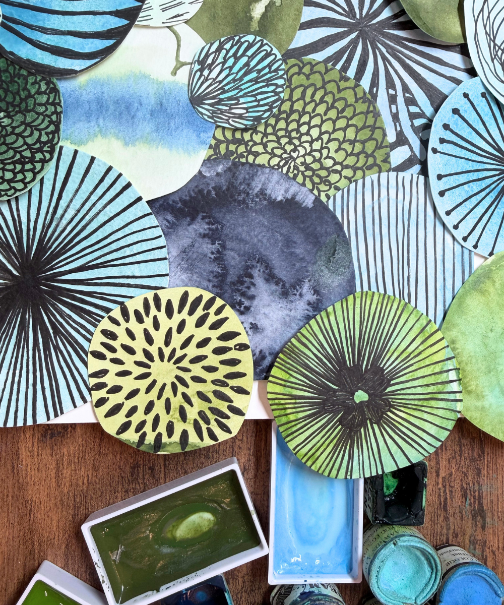 Nine-grid Calming Circles watercolor collage framed on a kitchen counter