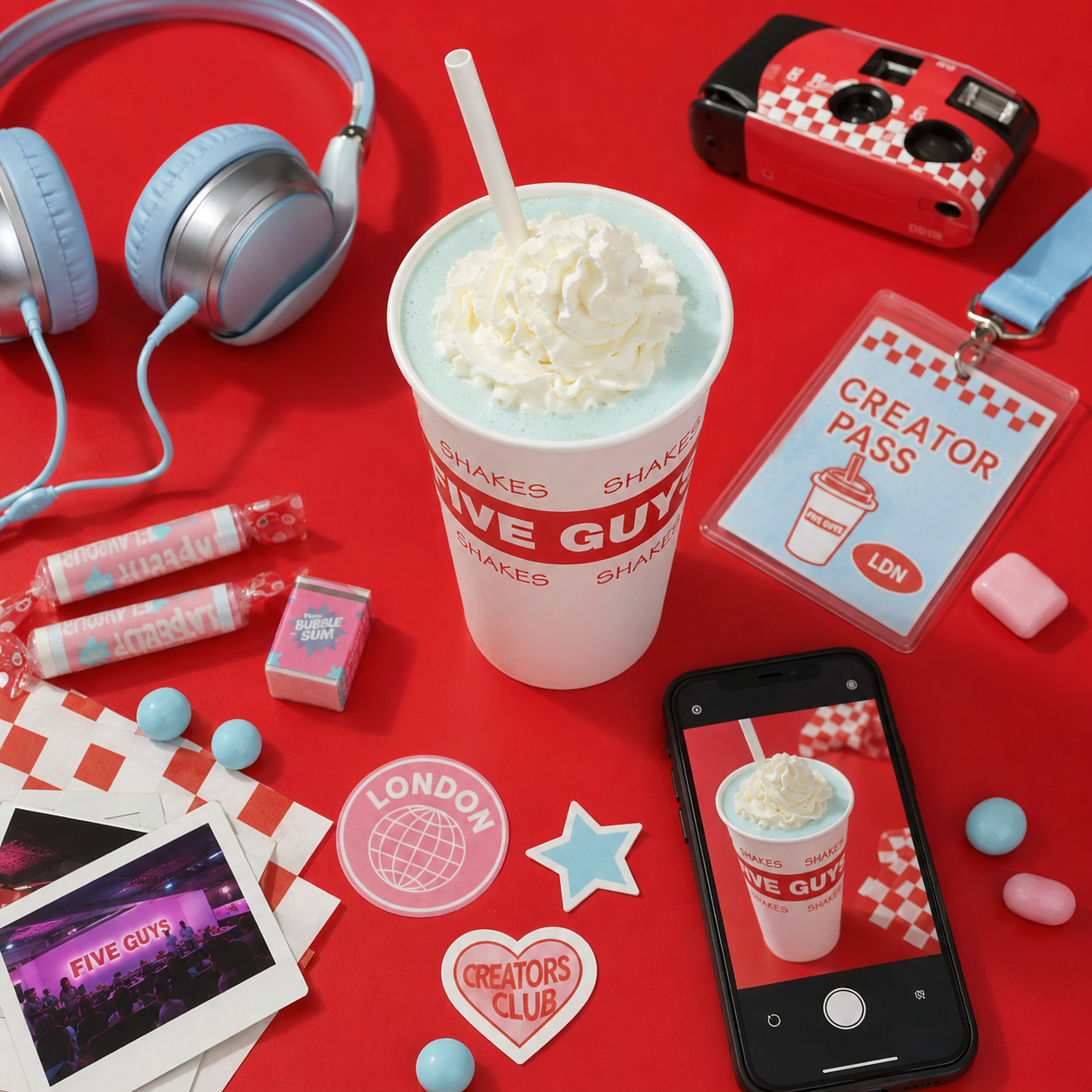 Bubblegum Shake event flatlay with creator pass, phone and props