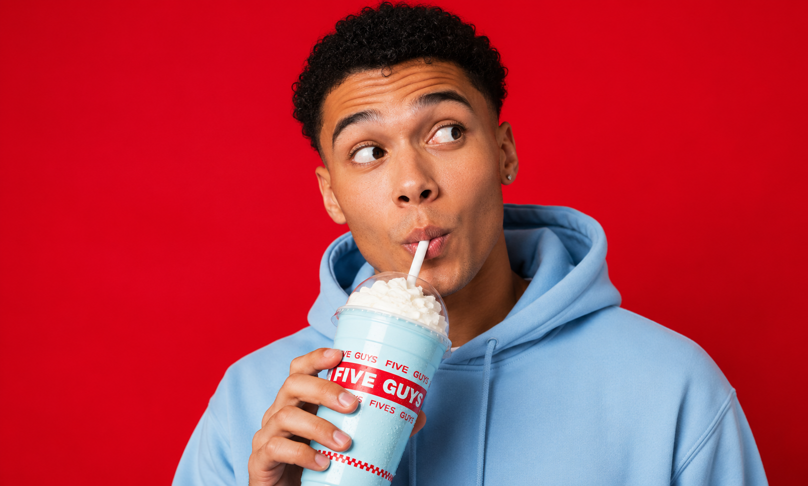 Creator drinking the Five Guys Bubblegum Shake, direct to camera