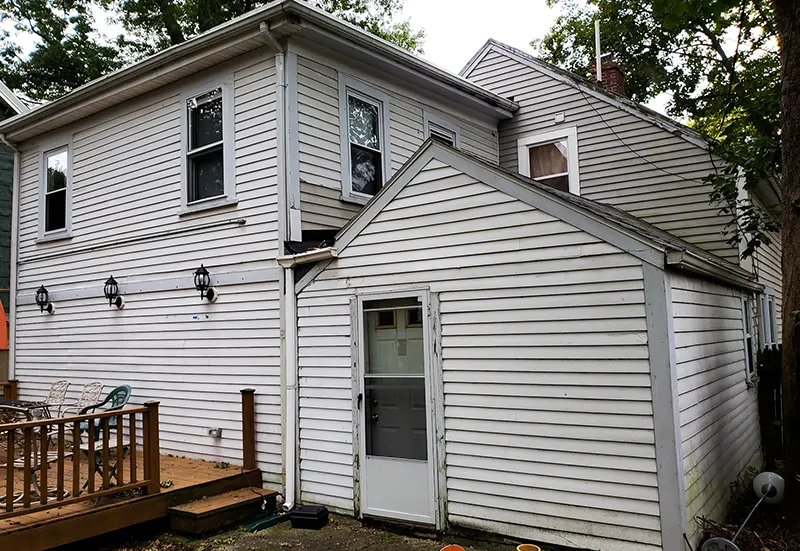 Roofing repair in MA team fixing shingles