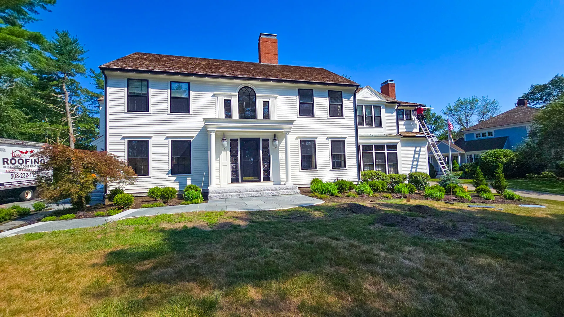 After - Black Gutters And Downspouts