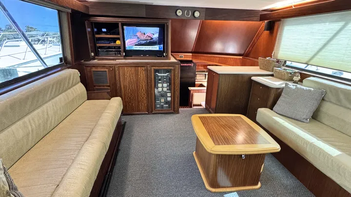 A/C salon on RingMaster—plush seating and galley with view to cockpit before a half-day charter
