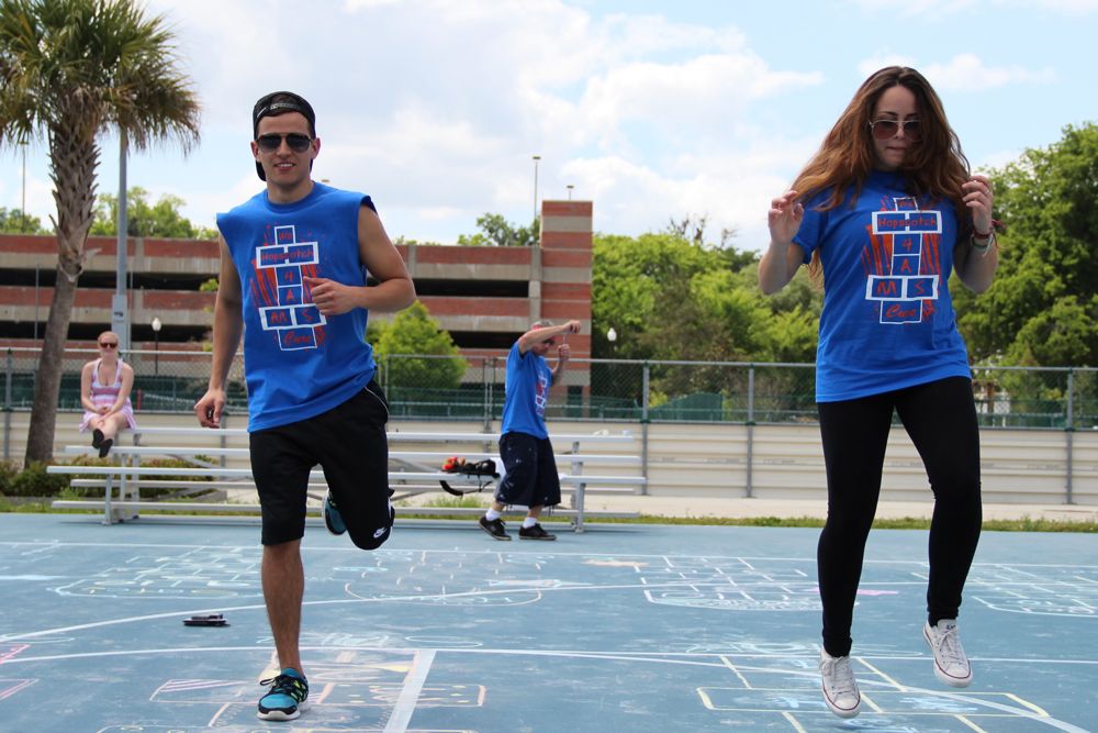 Two Recess Olympians race through hopscotch grids at a Hopping 4 A Cure Hopscotch Tournament.