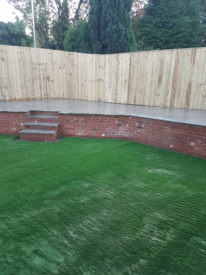 Patio, artificial grass and fencing project completed by JH Landscapes