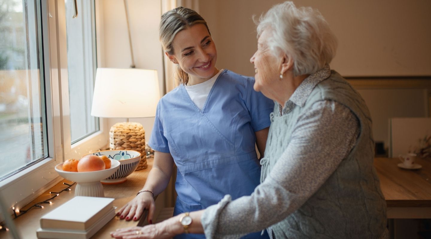 An AVet Cares caregiver spending time with a senior client outdoors in Augusta