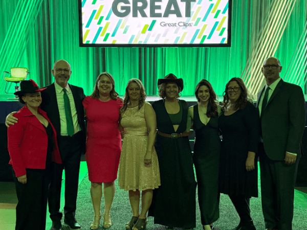 Tim and Hannah Renyi with their Great Hair in Maine team at Great Clips national conference