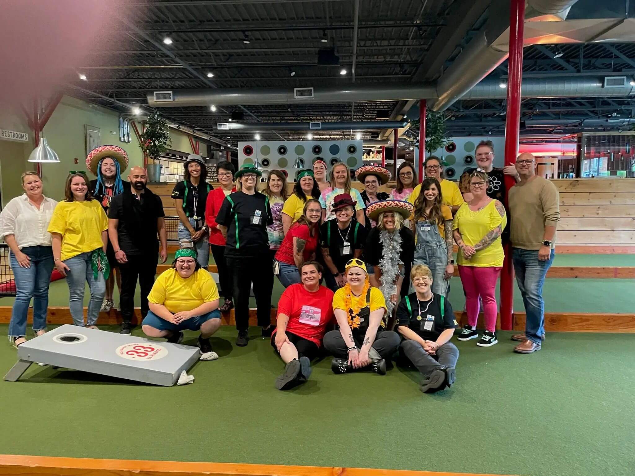 Great Clips Maine team celebrating with cornhole tournament, showcasing fun salon culture and supportive staff environment.