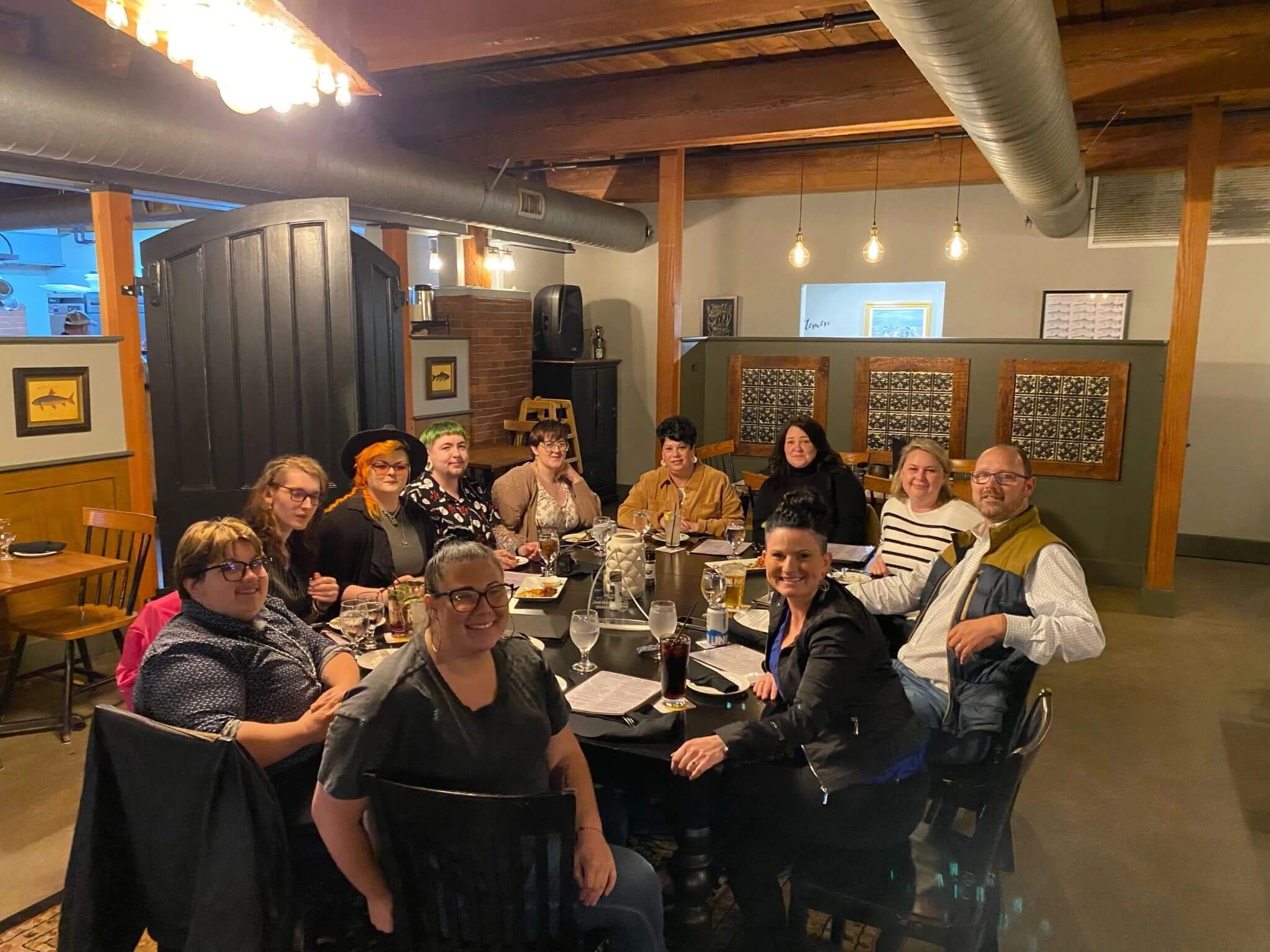 Salon staff at Great Hair in Maine participating in a holiday party, celebrating teamwork and family-friendly work culture.