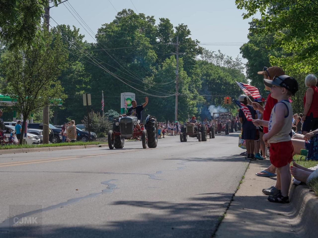 Spectators watch the Grass Lake 4th of July Parade