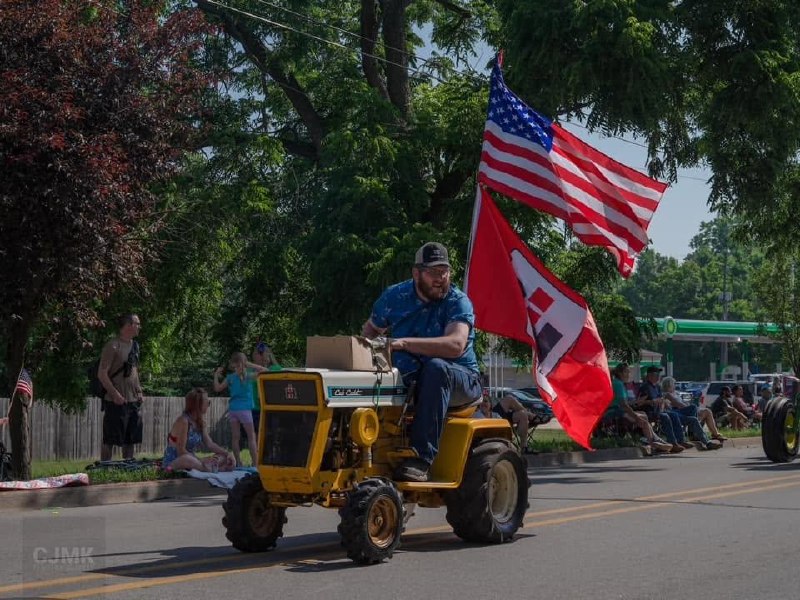 Man on a Cub Cadet tractor in the Grass Lake 4th of July Parade