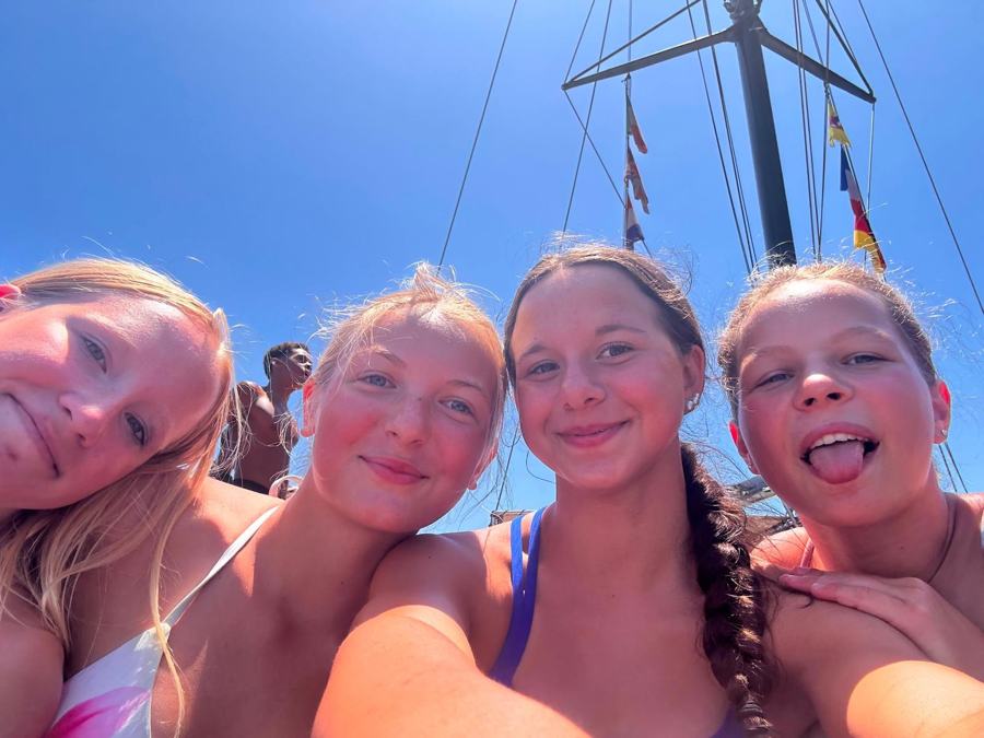 Four swimmers on the boat trip