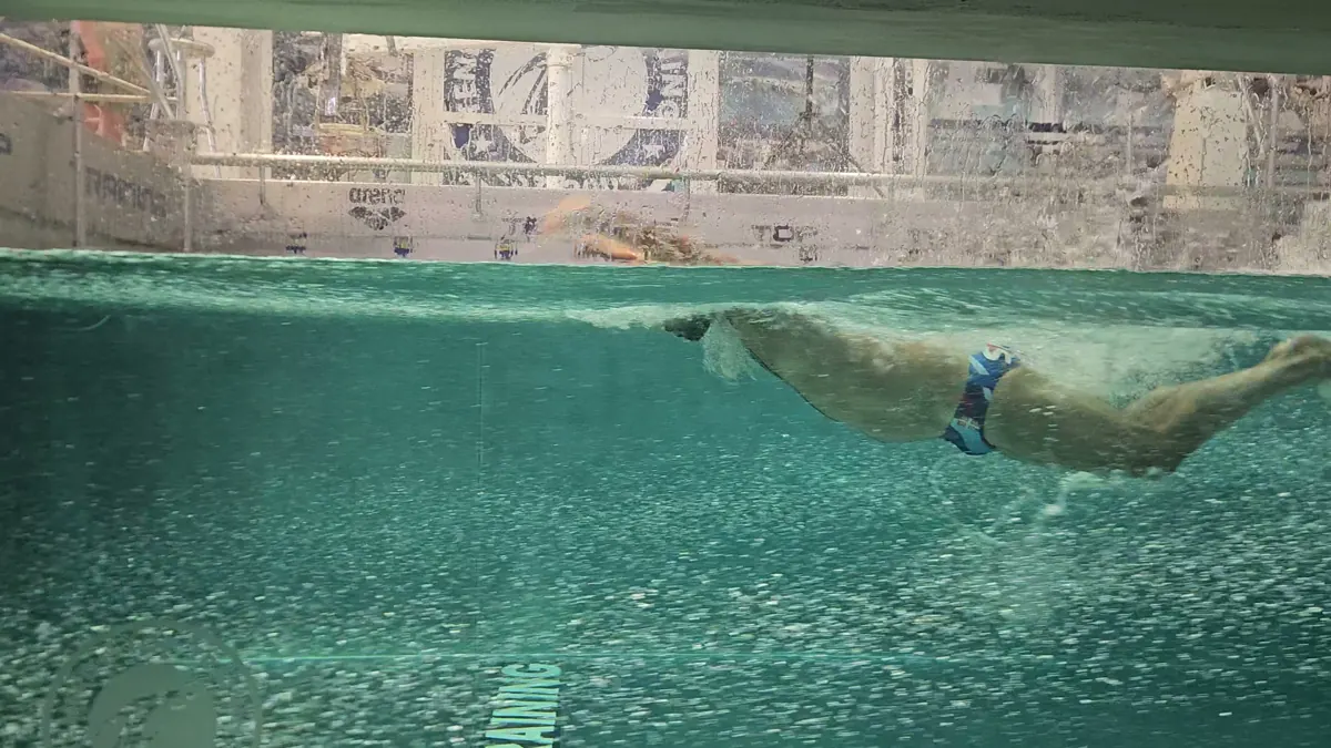 Under water view of a swimmer in the flume
