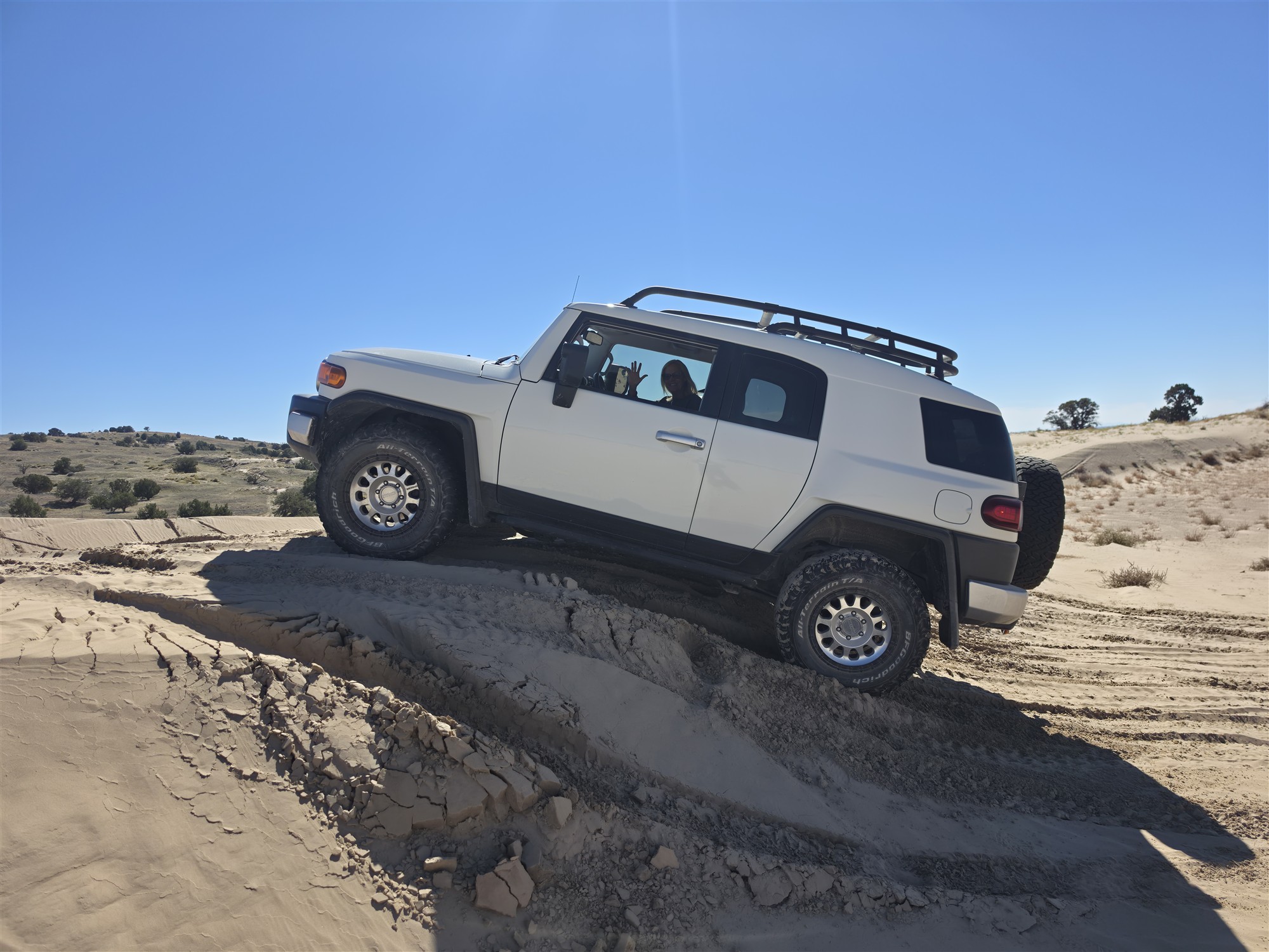 The Albino Rhino on sandstone terrain beneath a blue Utah sky