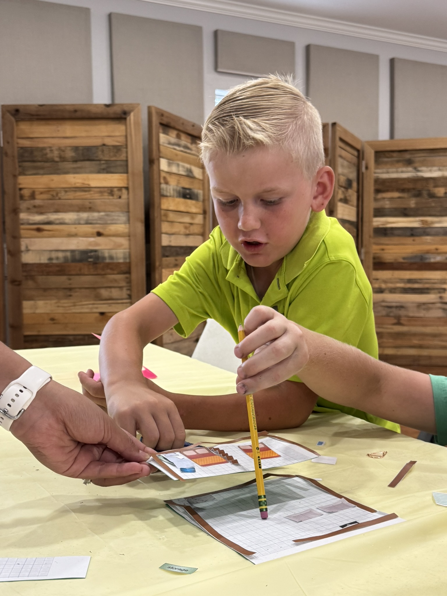 Students showcasing their work at summer camp, June 2025