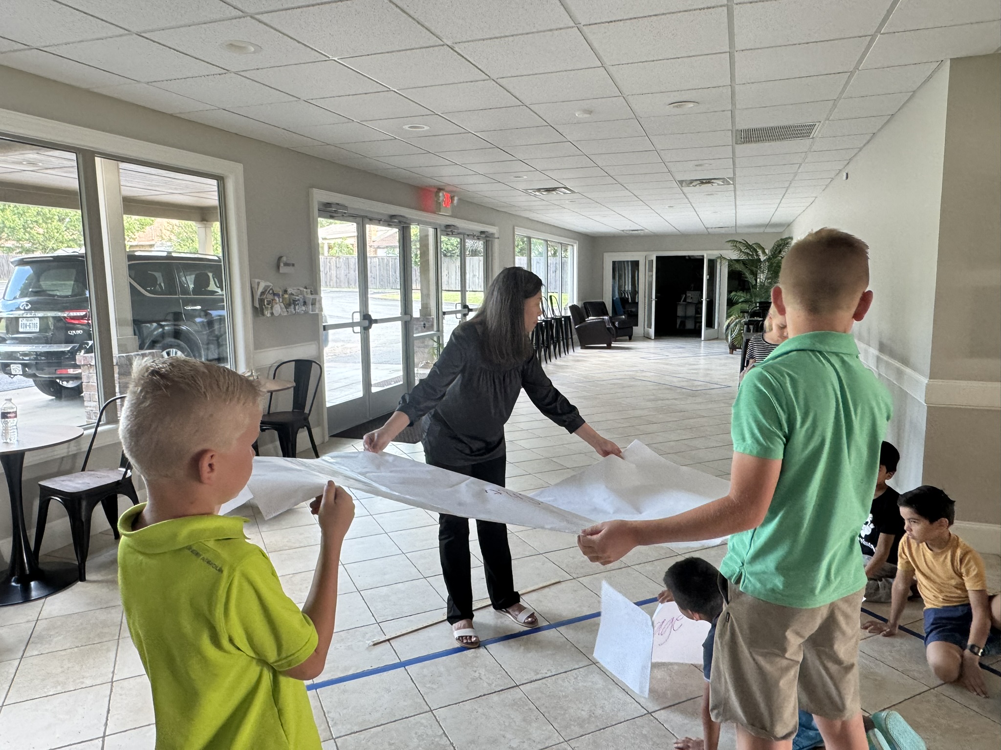 Students problem-solving at summer camp, June 2025