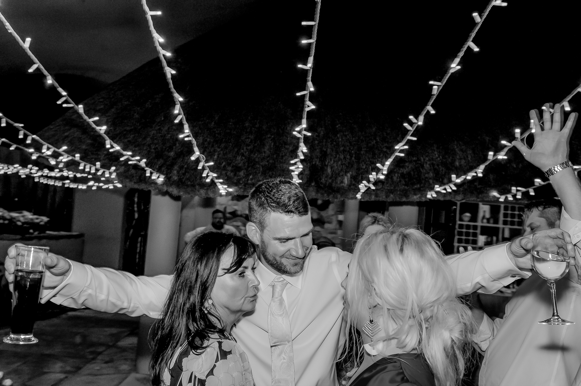 Wedding guests cheering on the dance floor