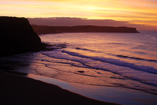 Sunset over Los Locos. Surfing waves in Spain