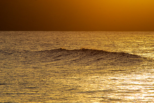 Sunset over Los Locos. Surfing waves in Spain